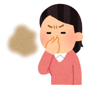 臭いと鼻をつまむ女性